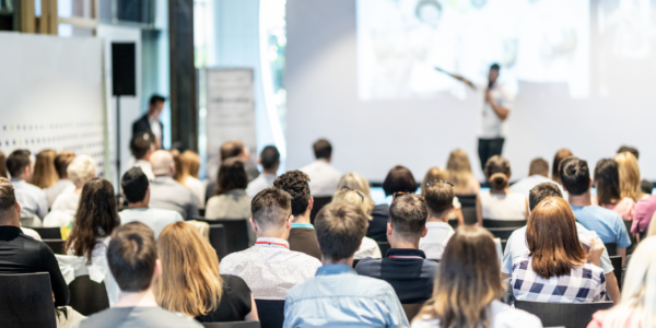 group of speakers at a conference